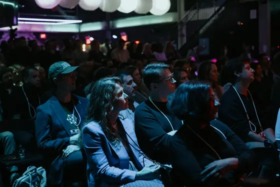 Front rows of the RevFest audience watching a session