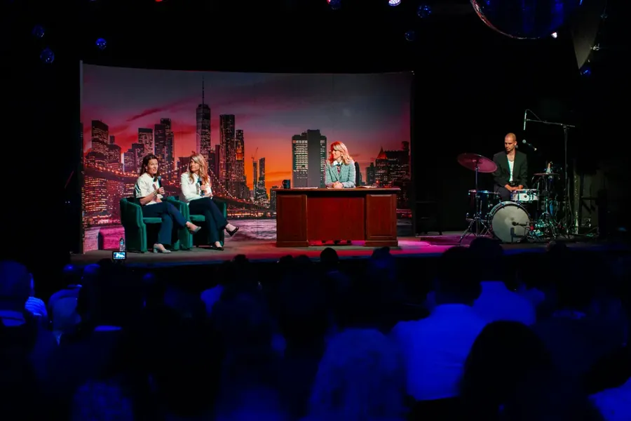 Panel taped live on stage in front of a packed RevFest room