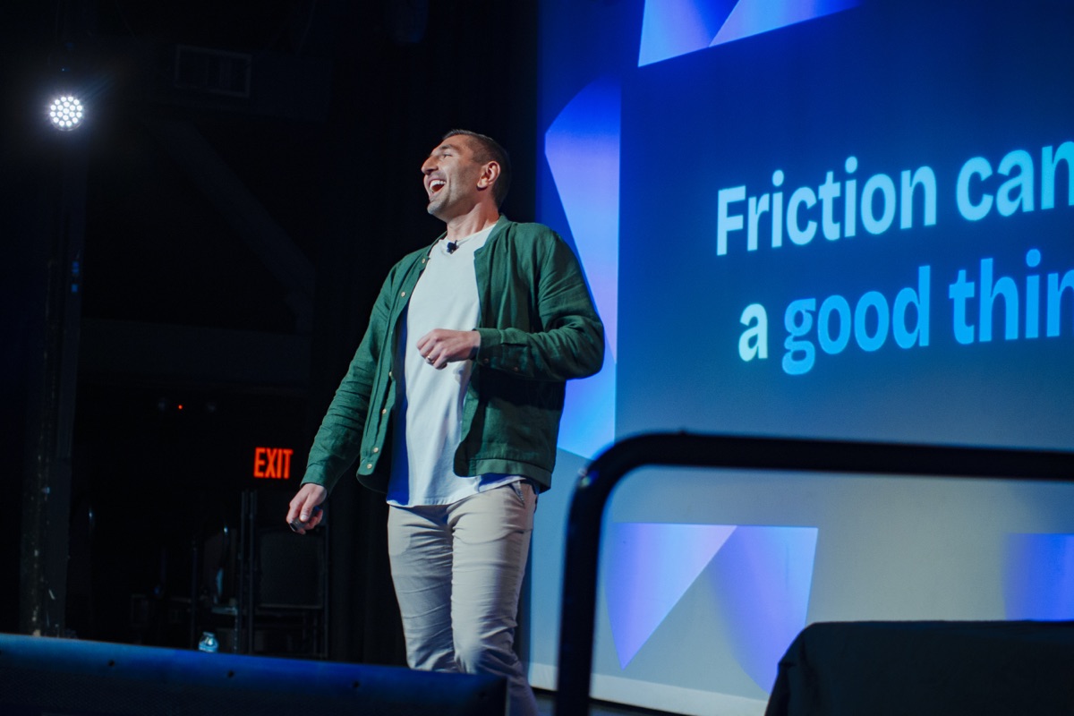 Ruslan Tovbulatov presenting on the RevFest stage
